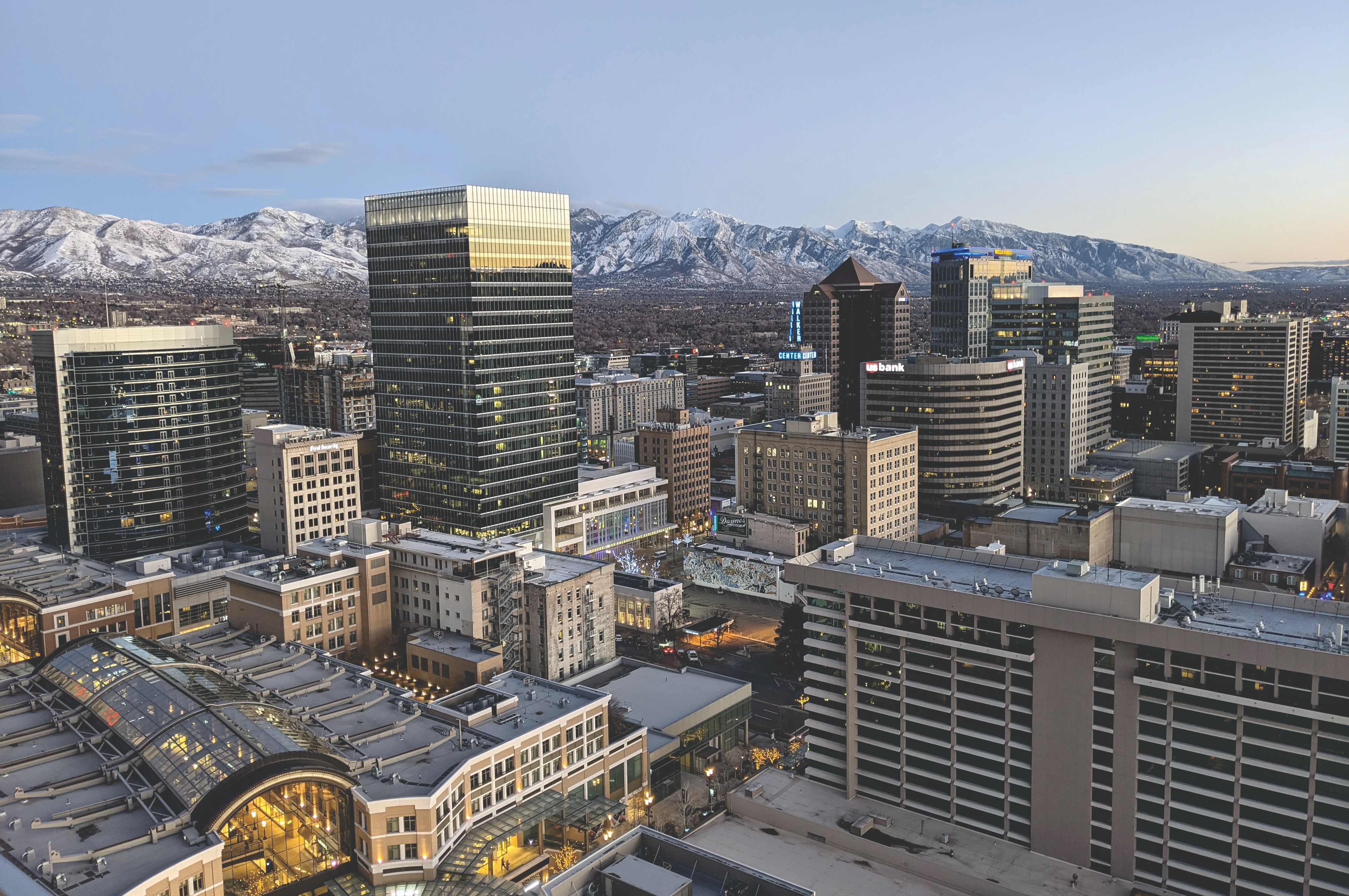 A view of the Salt Lake City skyline, with snowcapped mountains in the background